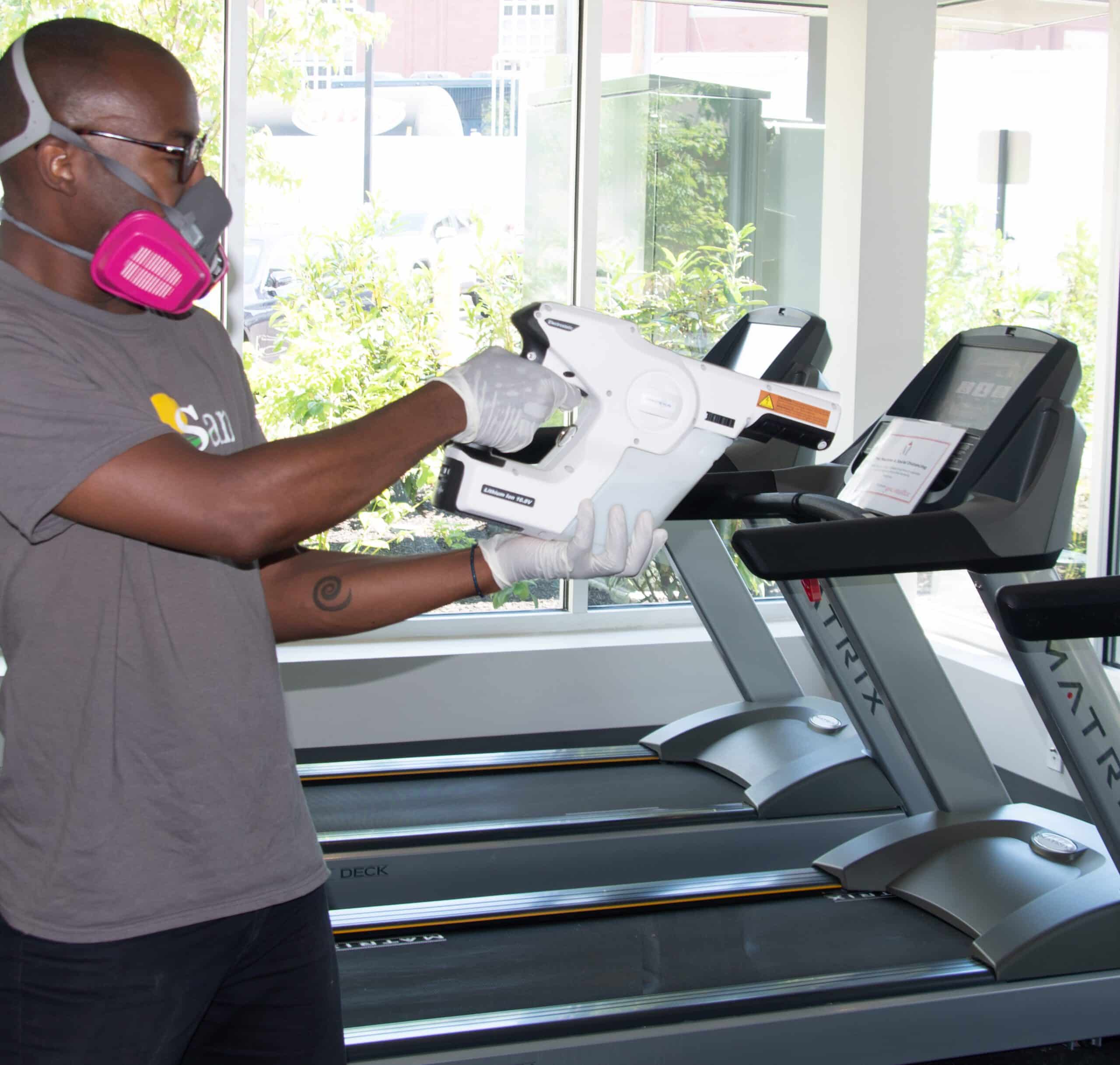 Deep Cleaning services - Staff with electrostatic machine doing cleaning